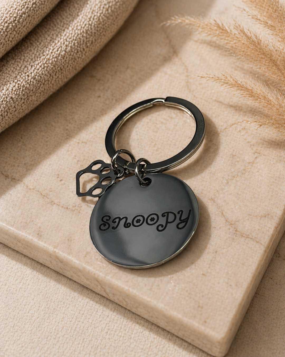 Porte-clés rond avec pendentif patte de chien